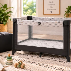 Portable mesh playard set up in a bright modern nursery.